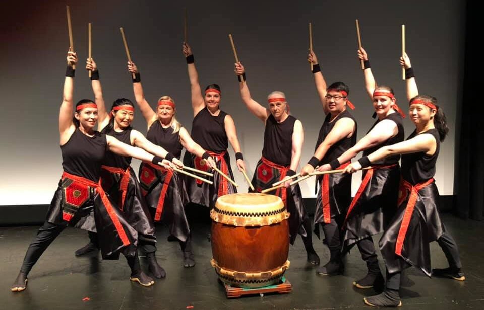 Taiko drummers inside performance